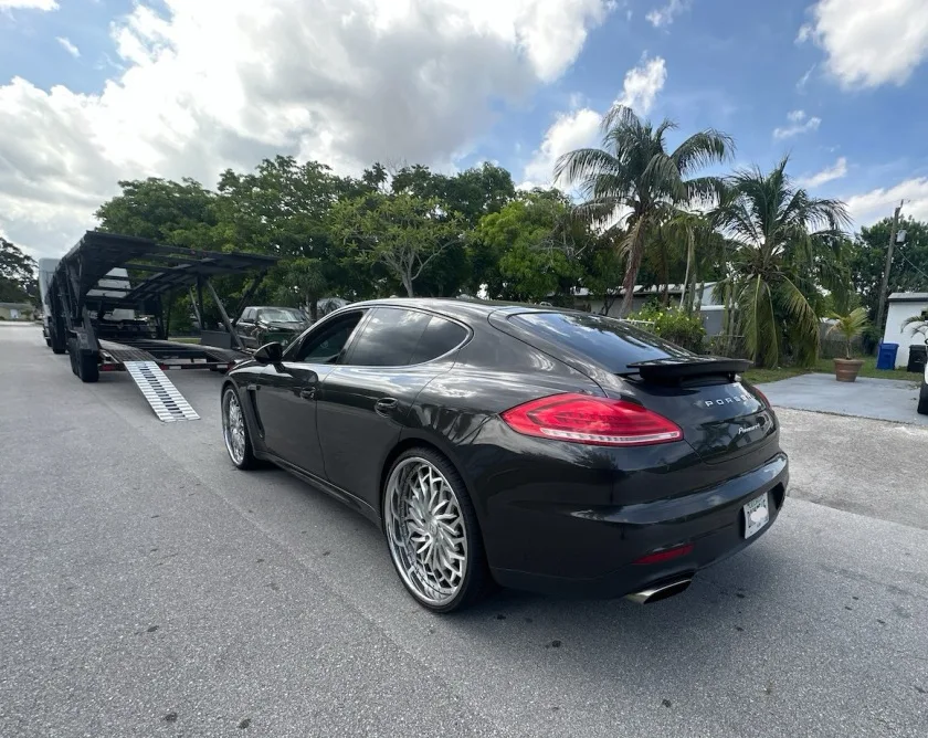 Auto transport carrier on highway delivering vehicles between states